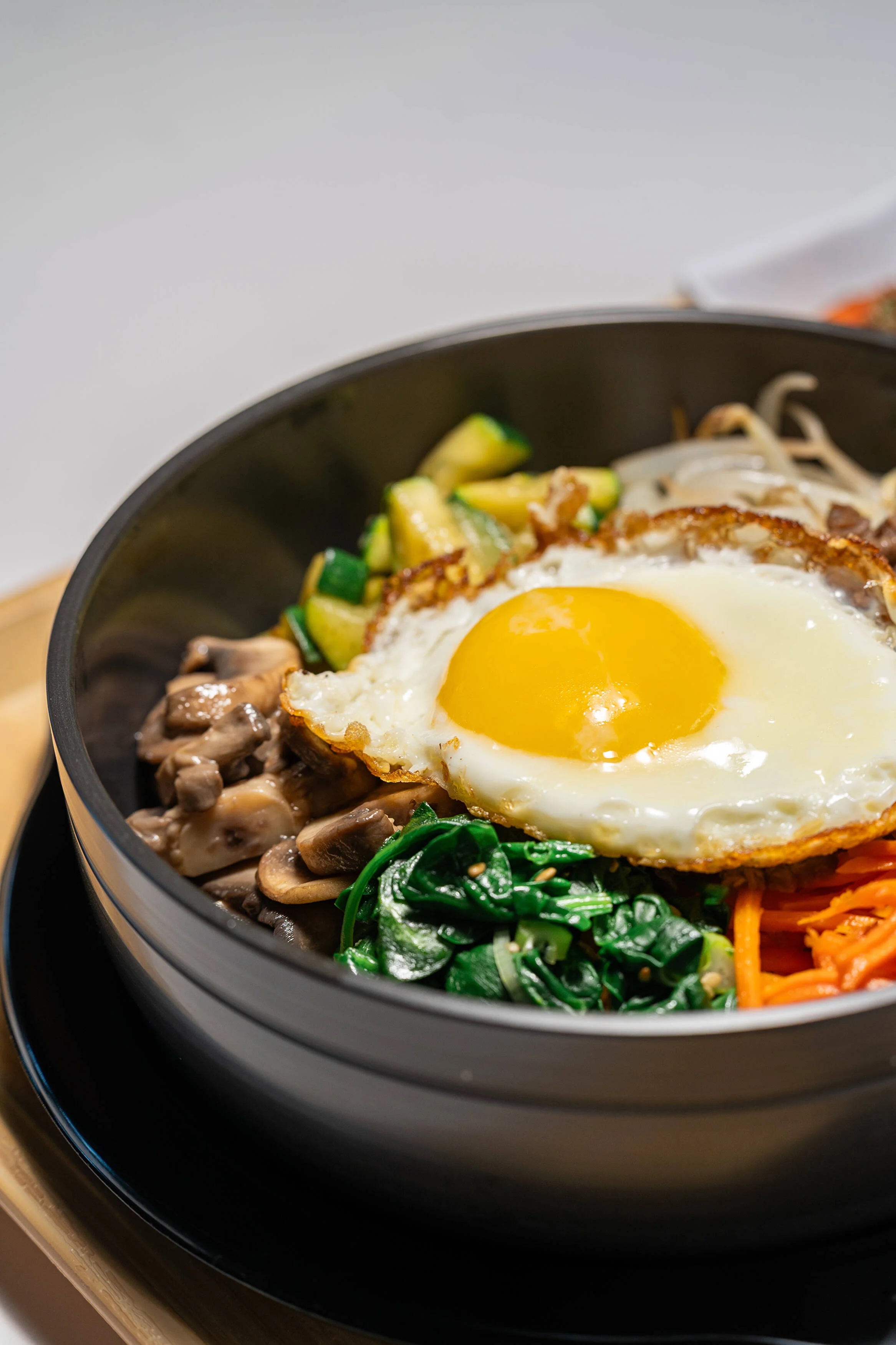 Bibimbap — rice bowl with vegetables and fried egg